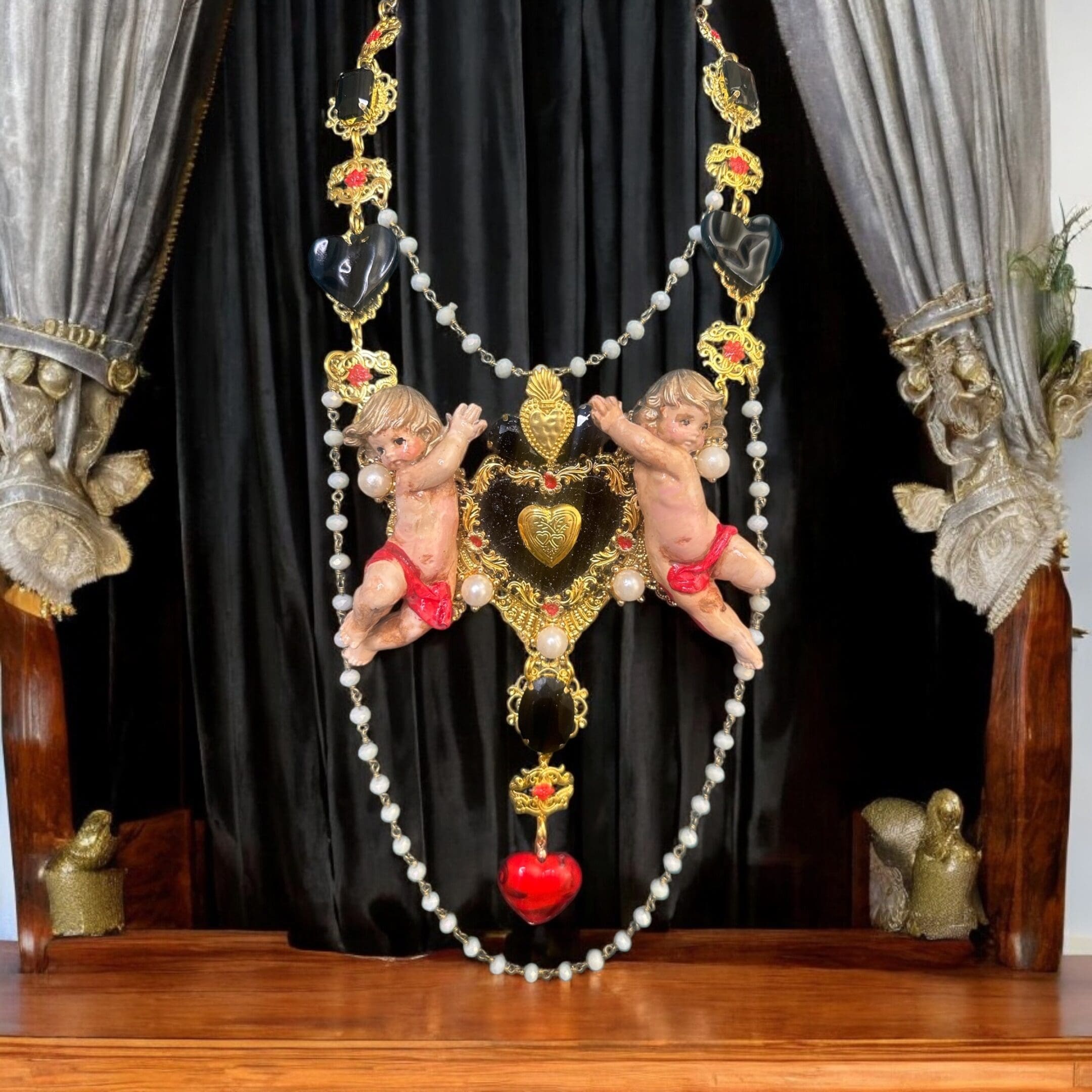 A table with curtains and a black curtain