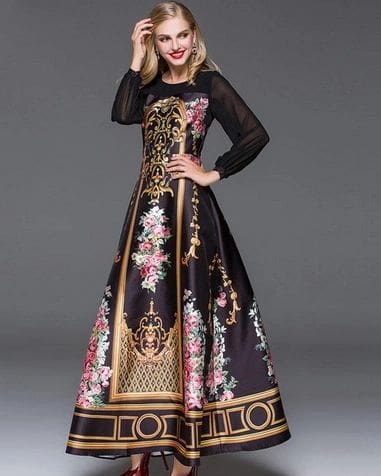 A woman in a black and gold dress