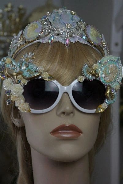 A mannequin wearing sunglasses and a headband.