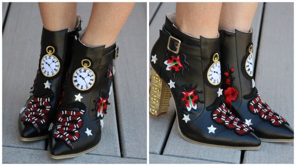 A pair of shoes with clocks and stars on them.